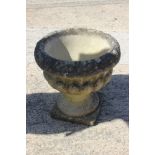 A cast stone urn, 14" dia x 15" high, a cast stone rectangular planter with swag decoration, 23"