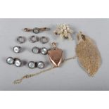 A 9ct gold shield-shaped locket, a 9ct gold fine link necklace, a set of mother-of-pearl dress studs
