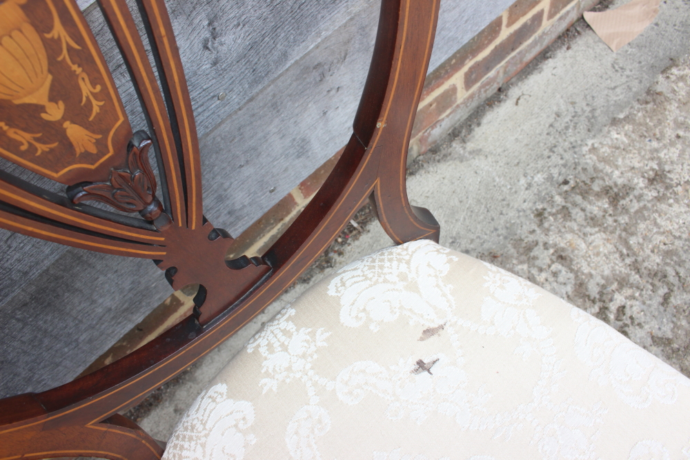 Three mahogany and string inlaid shield back side chairs, upholstered in a cream brocade, on - Image 5 of 5