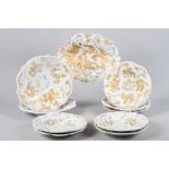 A 19th century Meissen part dessert service with raised and gilt Rococo style decoration