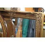 A gilt framed rectangular wall mirror with bevelled plate, 23 1/2" x 35 3/4"