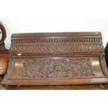 A 19th century oak over-door moulding, carved gadroons, scrolls and central mask, 43" long x 21"