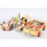 Four mid century pull-along wooden toys