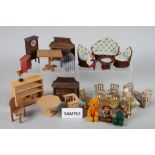 A collection of dolls house furniture and accessories