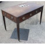 An early 19th century mahogany centre table/library table, fitted four drawers with faux drawers