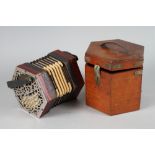 A late 19th century concertina, in case (bellows repaired)