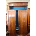A French 19th century walnut armoire enclosed two panelled doors, on stile supports, 52" wide x