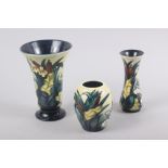 A Walter Moorcroft "Bullrush" pattern flared rim vase, 6" high, a similar smaller vase, 5" high, and