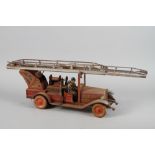 A German tin-plate model of a fire engine, 28 3/4" long overall (rusted)