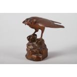 Dave Tomlinson: a signed limited edition bronze, hawk perched on a rock, 4" high