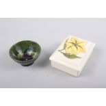 A Moorcroft rectangular yellow "Yellow Lily" pattern trinket box and cover, 4 3/4" x 3 1/2", and a