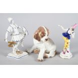 A Nymphenburg porcelain seated puppy, 6" high, a Sitzendorf figure of a warrior, 8" high (