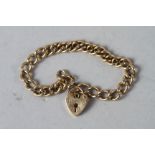 A 9ct gold curb link bracelet with heart-shaped padlock clasp, 15.2g