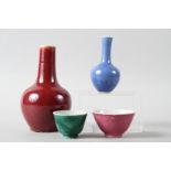 A Chinese sang de boeuf pottery sprinkler vase, 7" high, a blue monochrome vase (restoration to