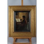 A Boyd?: oil on board, woman playing the piano, 11 1/2" x 8 1/2", in gilt strip frame
