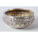 A silver fruit bowl with embossed decoration, marks rubbed, 16.4oz troy approx