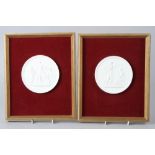 A pair of Copenhagen bisque porcelain relief moulded panels, in gilt frames