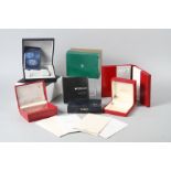 A number of wristwatch boxes, including Longines, Omega, Tissot, Tudor, etc, and wristwatch booklets