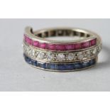 A yellow metal, diamond, ruby and sapphire dress ring, size N, 4.5g