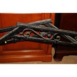 A pair of wrought iron handrails for a set of steps, 60" long