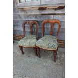 A pair of late 19th century side chairs with pierced splat backs, on turned supports