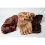 A mink stole, a similar hat and two rabbit fur stoles