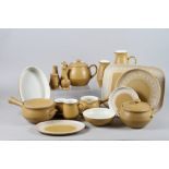 A Denby "Ode" pattern combination service, including meat plates, sauce boat, cups, saucers, etc