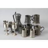 Five pewter tankards, various sizes, a copper hot water jug and a copper fondue set