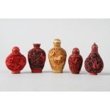 Four Chinese cinnabar lacquered snuff bottles and another similar snuff bottle, largest 2 3/4" high
