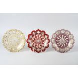 A set of three mid 19th century Bohemian overlaid cut and gilt glass dessert plates with engraved