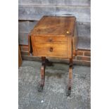 A Regency rosewood work table, fitted three drawers and flap top, on panel end splay supports, 32"