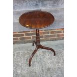 A 19th century mahogany circular tilt top table, on turned column and tripod splay support, 17"
