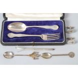 A silver christening spoon and fork set, a silver swizzle stick, a pair of silver Concorde