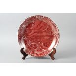A William de Morgan red lustre charger, decorated eagle and snake, 14" dia