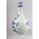 A Chinese porcelain blue and white fence and peony decorated bottle vase, 9 1/2" high