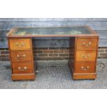 A Victorian mahogany desk with tooled lined top, fitted seven drawers, on block base, 54" wide x 27"