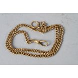 An 18ct gold curb link Albert chain, 17" long, 33.6g