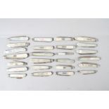 Approximately twenty-four silver bladed mother-of-pearl folding fruit knives