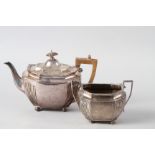 A silver teapot with gadrooned border and a matching sugar bowl, 28.4oz troy approx