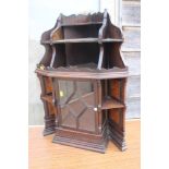 A late 19th century oak and walnut corner hanging cabinet enclosed lattice glazed door, 20" wide x