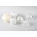 A set of three early 20th century graduated shades and three other milk glass shades