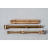 A S Mordan & Co 9ct gold cased carpenter's pencil and two yellow metal propelling pencils