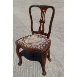 A 19th century mahogany side chair with pierced splat back and needle point seat, on cabriole claw