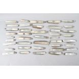 Approximately forty silver bladed mother-of-pearl folding fruit knives