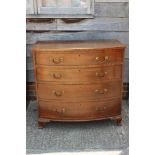 A 19th century mahogany bowfront chest of four long graduated drawers with brass swag handles, on