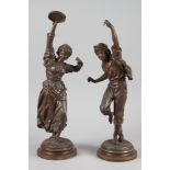 After Rancoulet: a pair of "bronzed" spelter figures, the Musicians, a man with castanets, on