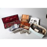 A surgeon's urology set, cased, a tracheotomy set, scissors, cased, and syringes, kidney dishes, etc