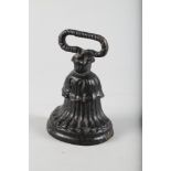 A 19th century cast iron bell-shaped doorstop, 7" high