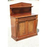 A 19th century mahogany chiffonier with ledge back over two drawers and two cupboards, on block