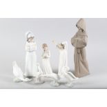 A Lladro brown bisque figure of a bearded monk, 2060, 13" high, a Lladro figure of a boy with